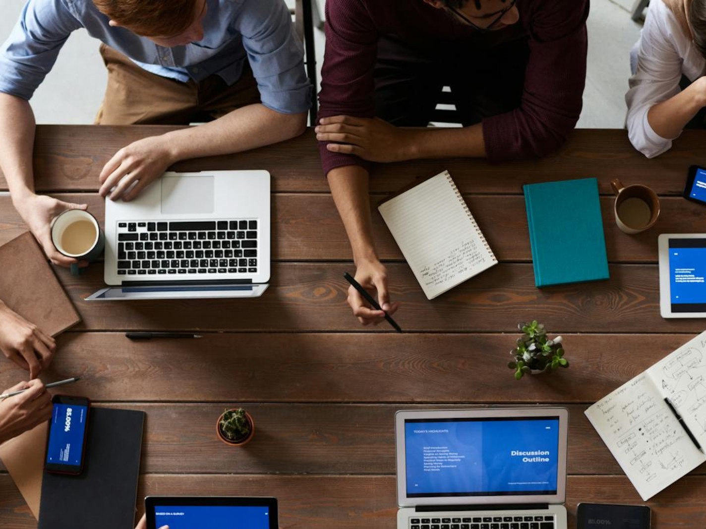 Illustrative meeting around a table, not an EportPass team photograph
